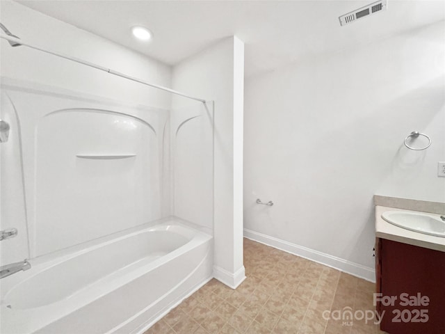 bathroom featuring shower / bathtub combination, vanity, visible vents, baseboards, and tile patterned floors