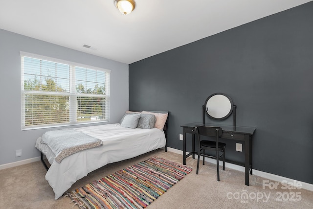 bedroom featuring carpet, visible vents, and baseboards