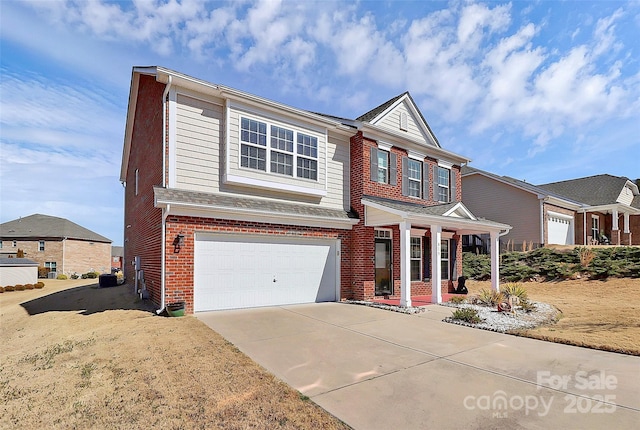 view of front of house featuring an attached garage, concrete driveway, and brick siding