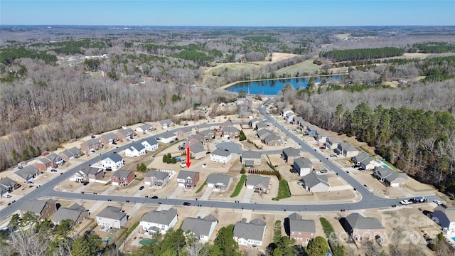 bird's eye view featuring a water view and a residential view