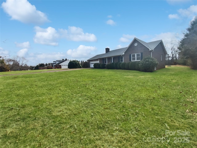 view of yard featuring an attached garage