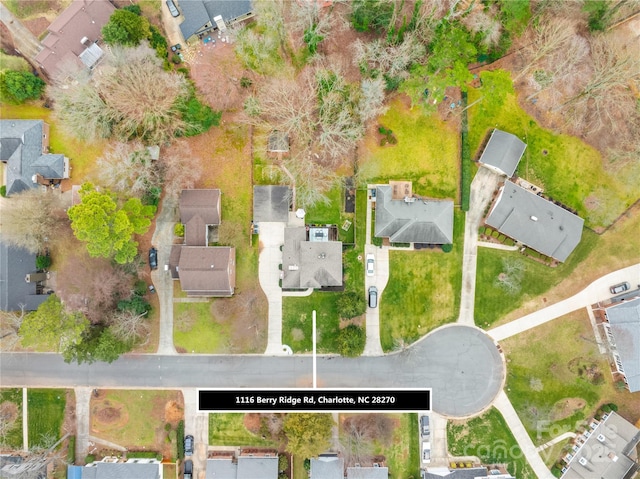 birds eye view of property with a residential view