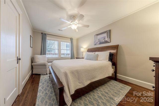 bedroom with visible vents, crown molding, baseboards, and wood finished floors