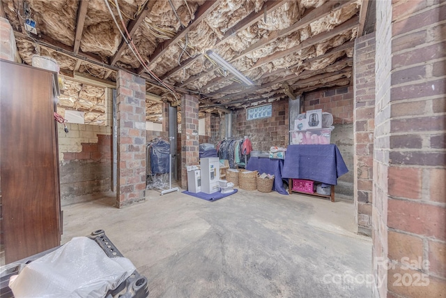 unfinished basement with brick wall