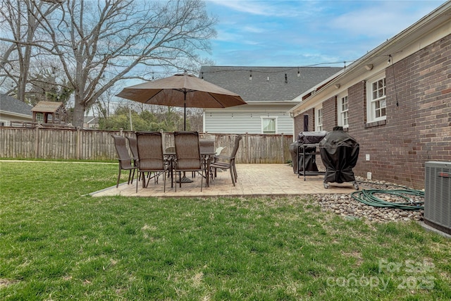 view of yard with a patio, cooling unit, and fence