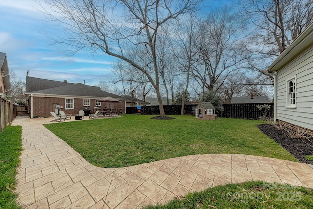 view of yard featuring a patio and a fenced backyard