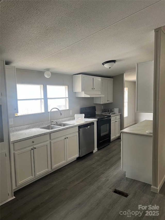 kitchen with stainless steel dishwasher, white cabinetry, dark wood-style flooring, and a sink