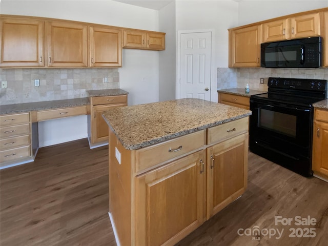 kitchen featuring light stone counters, dark wood-type flooring, a kitchen island, decorative backsplash, and black appliances