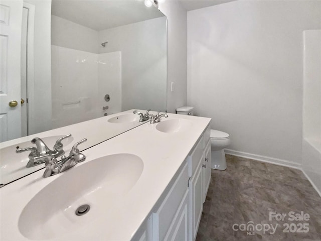 bathroom with shower / tub combination, a sink, and toilet