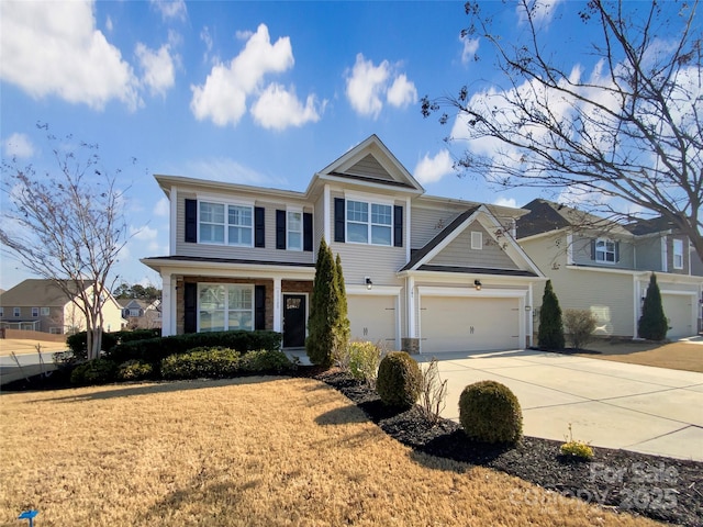 view of front facade with driveway and a front yard