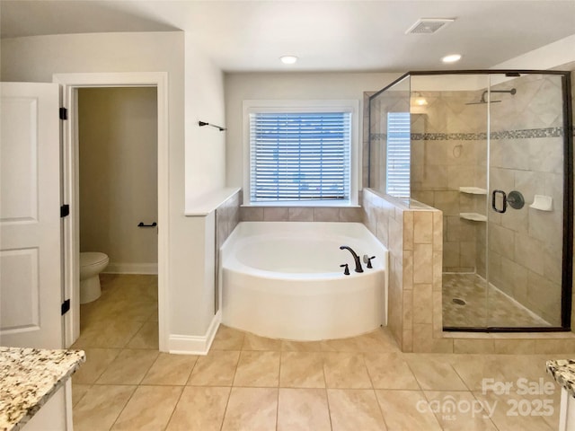 bathroom with a stall shower, visible vents, tile patterned floors, and a bath