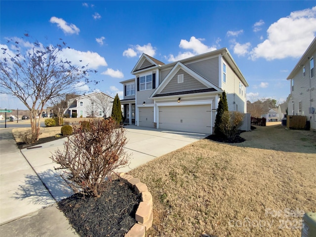 view of front of property featuring driveway, an attached garage, and a residential view