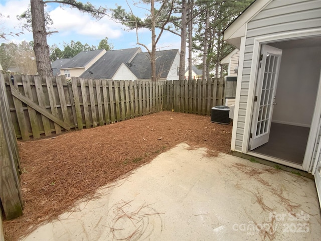 view of yard with a patio, cooling unit, and a fenced backyard