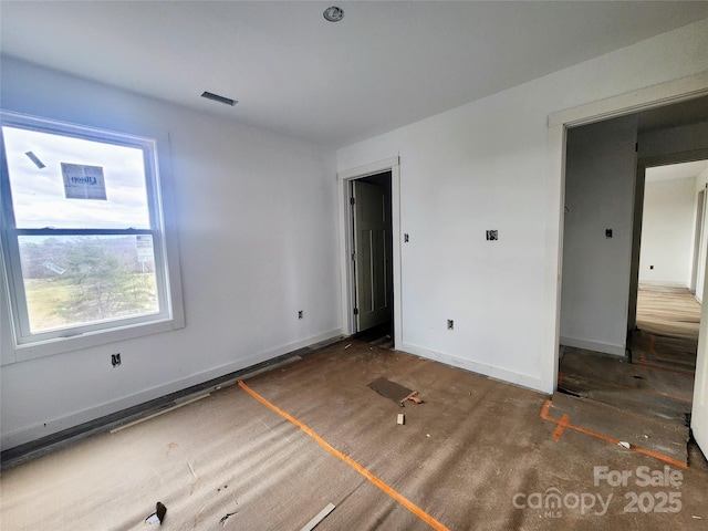 unfurnished bedroom featuring baseboards