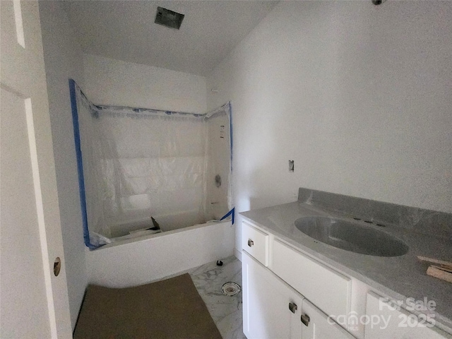 full bathroom featuring marble finish floor, bathtub / shower combination, and vanity