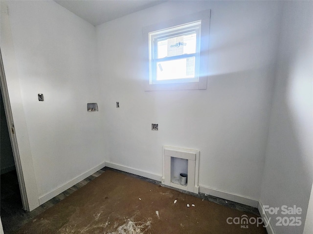 washroom featuring laundry area, washer hookup, and baseboards