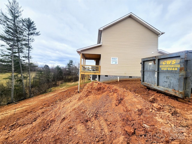 view of side of property featuring crawl space