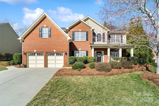 view of front facade featuring driveway, brick siding, a front lawn, and an attached garage