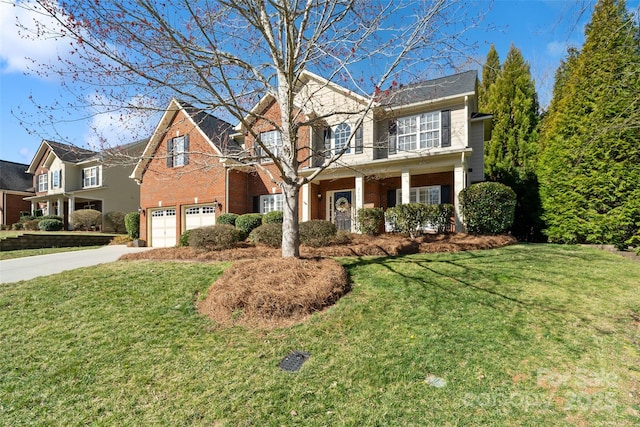 traditional-style home with brick siding, driveway, an attached garage, and a front lawn