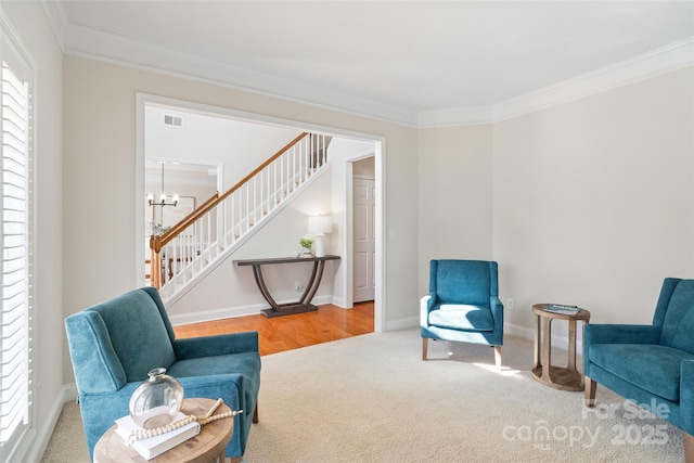 sitting room with crown molding, stairway, and visible vents