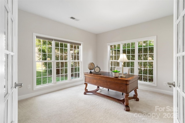 office area with visible vents, carpet flooring, and baseboards