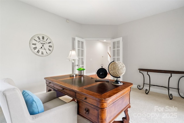 office area featuring baseboards and carpet