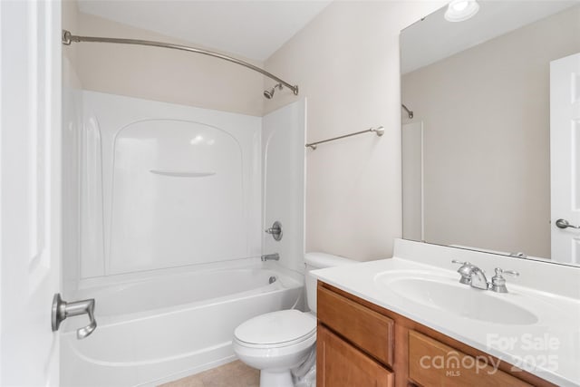 bathroom featuring bathtub / shower combination, toilet, and vanity