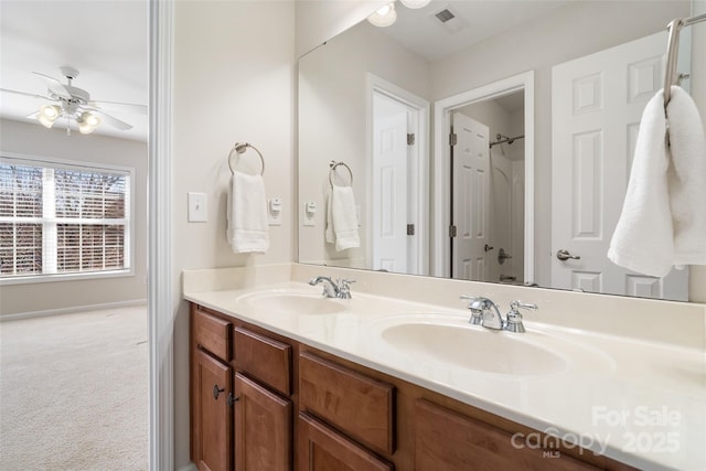 bathroom featuring a sink, visible vents, ceiling fan, and double vanity