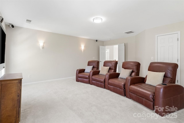 home theater with baseboards, visible vents, and carpet floors