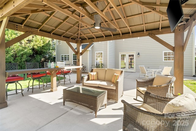 view of patio featuring a gazebo, outdoor dining area, french doors, and an outdoor hangout area