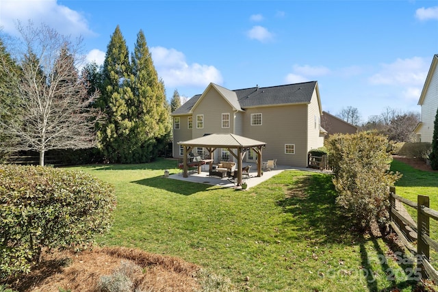 back of house featuring a gazebo, a yard, fence, and a patio