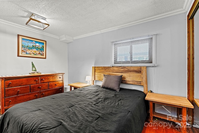 bedroom with a textured ceiling, ornamental molding, and wood finished floors