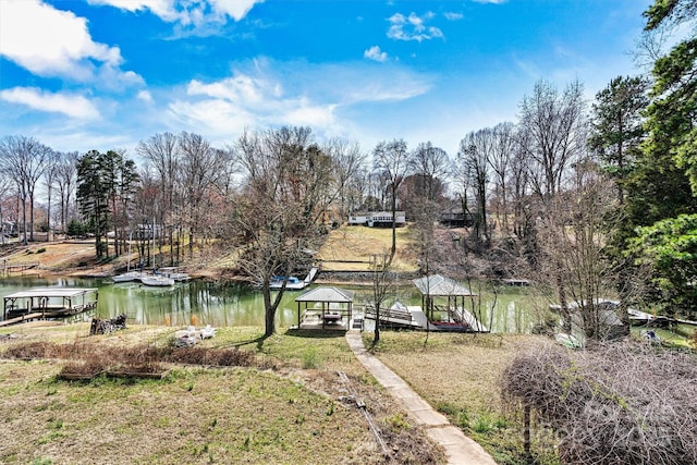 view of dock with a water view and a gazebo