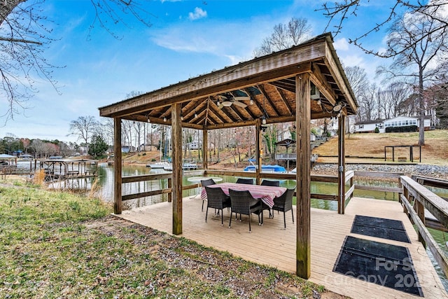 view of dock featuring a wooden deck and a gazebo