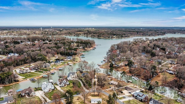 birds eye view of property with a water view and a residential view