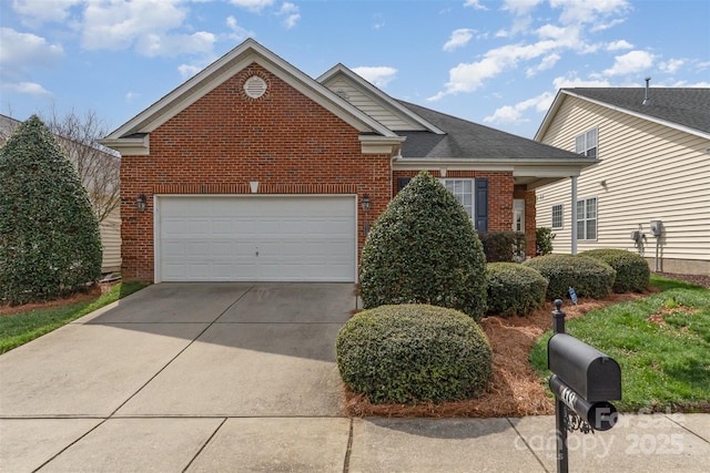 view of front of house featuring brick siding, an attached garage, and driveway