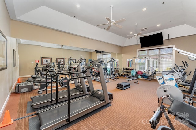 exercise room with carpet floors, a healthy amount of sunlight, and ceiling fan