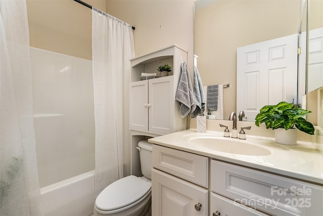 bathroom featuring shower / bath combination with curtain, toilet, and vanity