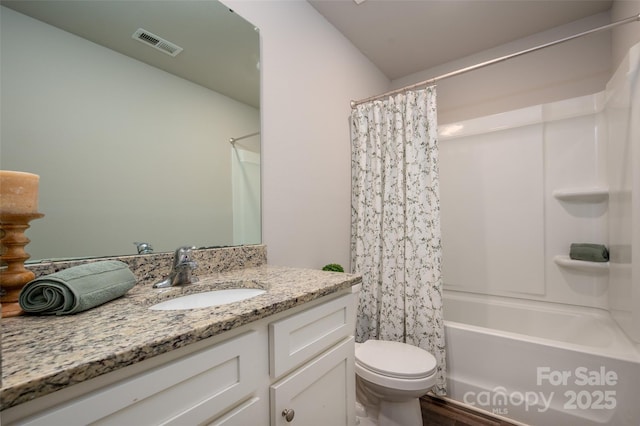 bathroom with toilet, visible vents, shower / bath combination with curtain, and vanity