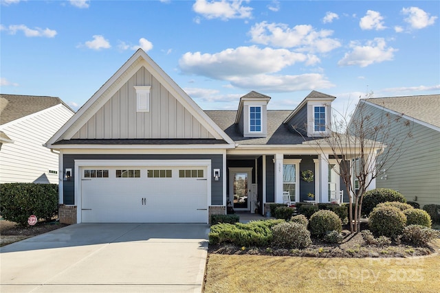 view of front of house with board and batten siding, brick siding, and driveway