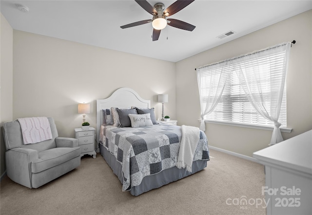 bedroom featuring baseboards, carpet floors, visible vents, and a ceiling fan