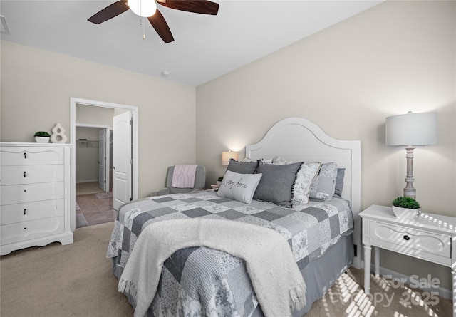 bedroom featuring visible vents, carpet, and a ceiling fan