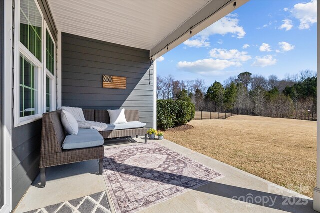 view of patio featuring fence