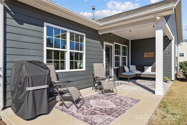 view of patio with area for grilling and an outdoor hangout area