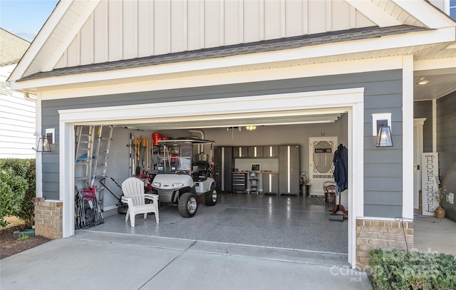 garage featuring concrete driveway