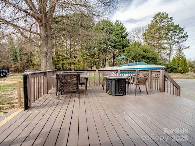 2200 Peninsula Ave, Shelby, NC 28150 - wooden deck with outdoor dining space and view of scattered trees
