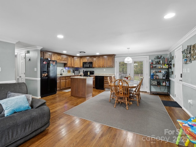 2200 Peninsula Ave, Shelby, NC 28150 - kitchen with black appliances, open floor plan, light countertops, a center island, and dark wood-type flooring