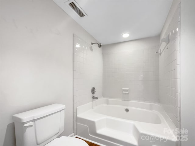 full bath featuring bathtub / shower combination, visible vents, and toilet