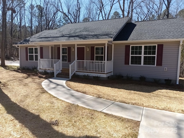 single story home with a porch and a shingled roof