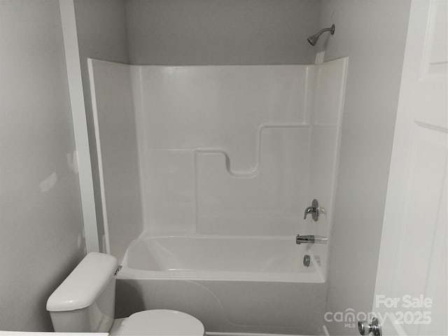 bathroom with toilet and bathtub / shower combination